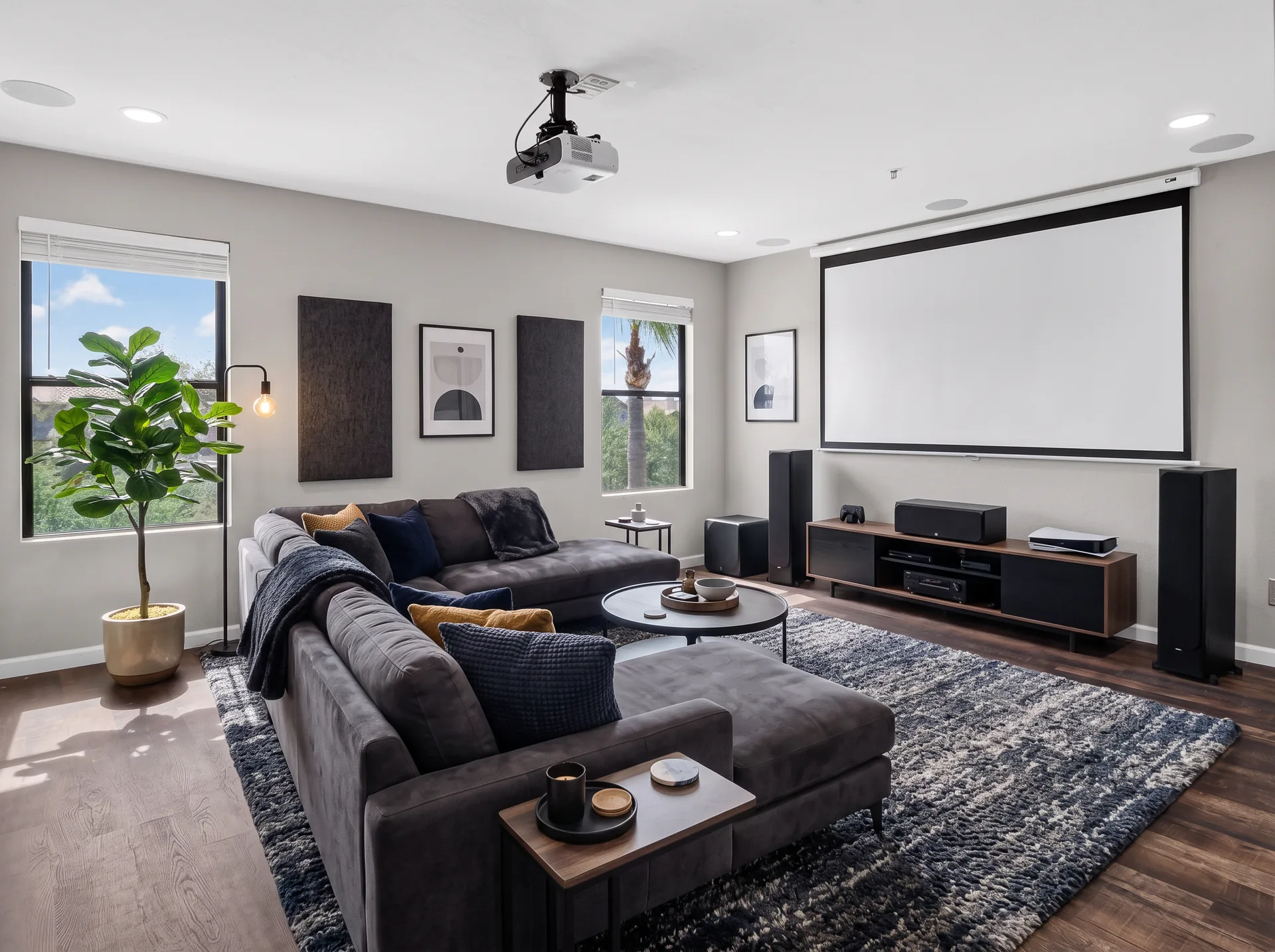 Empty media room vs virtually staged media room with sectional and projector screen — after