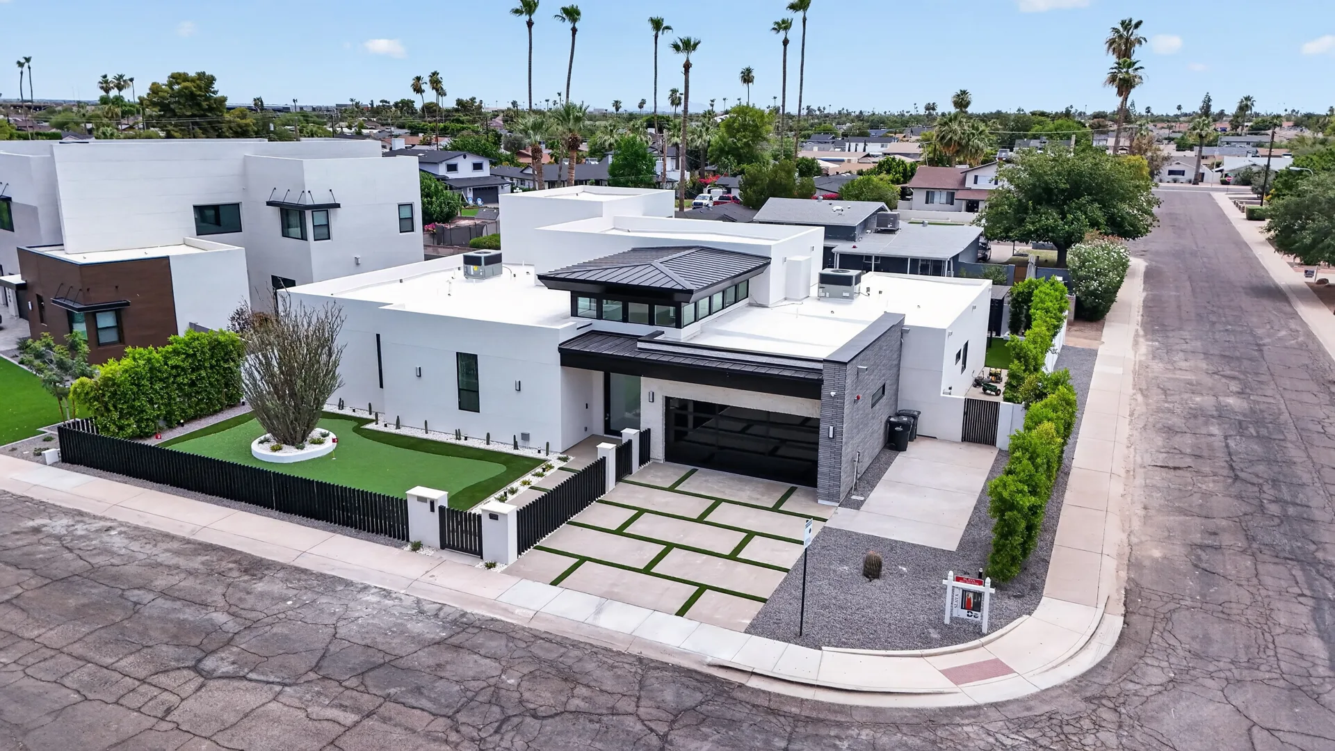White modern home, daytime vs twilight — before